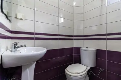 a bathroom with a toilet and a sink at AS Apartments in Ulcinj