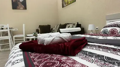 a room with two beds with pillows on them at Apartment Downtown in Podgorica