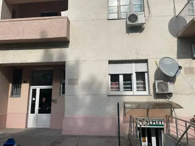 a building with a door and a person in it at Apartment Downtown in Podgorica