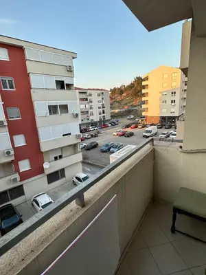 a balcony with a view of a parking lot at Ania apartment in Podgorica