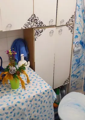 a room with a table and a vase with flowers on it at Montenegrina apartment in Ulcinj
