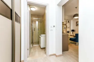 a bathroom with a shower and a toilet in a room at Apartman Petra in Pržno