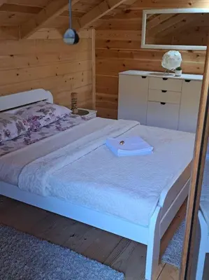 a room with two beds with a hat on it at Olive & sea, Luxury two bedrooms cabin for 8 in Ulcinj