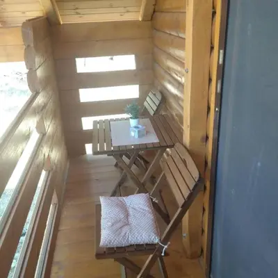 an inside view of a tiny house with a table and chairs at Olive & sea, Luxury two bedrooms cabin for 8 in Ulcinj