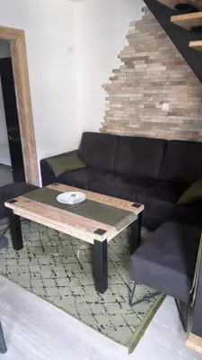 a living room with a coffee table and a couch at Apartman Anna Budva in Budva