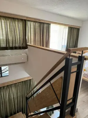 a staircase in a room with a bunk bed at Apartman Anna Budva in Budva