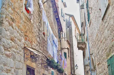 an alley in an old town with buildings at Apartment Amigo 2 Old Town Kotor in Kotor
