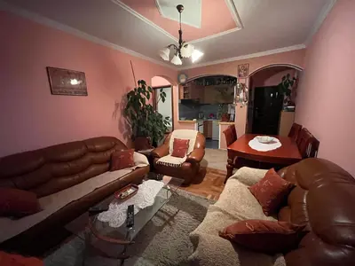 a living room with a couch and a table at PA Max apartment in Kotor