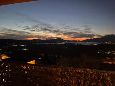 a view of a city at sunset at PA Max apartment in Kotor