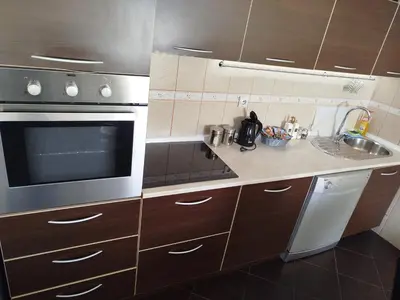 a kitchen with a microwave oven and a sink at Apartment Filipovic in Podgorica