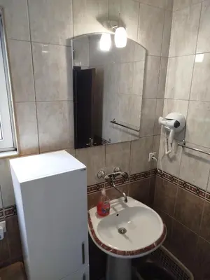 a bathroom with a sink and a mirror at Apartment Filipovic in Podgorica