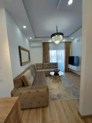 a living room with a couch and a table at Long beach luxury Premium apartments in Ulcinj