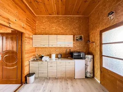 a kitchen with a refrigerator and a stove at River house Velero in Ulcinj
