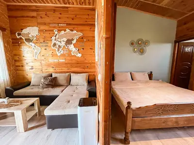a room with two beds in a wooden cabin at River house Velero in Ulcinj