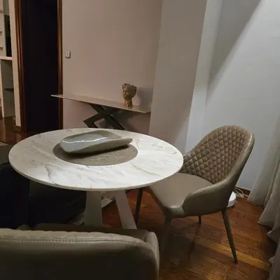 a table and two chairs with a computer mouse on it at Rosewood Podgorica in Podgorica