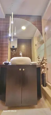 a bathroom with a sink and a mirror at Rosewood Podgorica in Podgorica