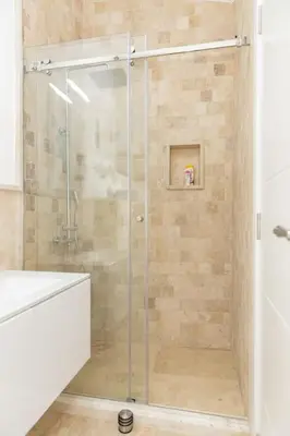a shower with a glass door in a bathroom at Villa Ella in Stari Bar