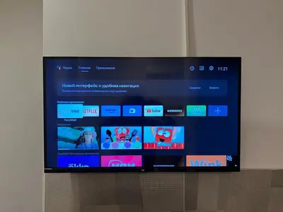 a flat screen tv sitting on top of a wall at Cozy studio Bečići in Becici