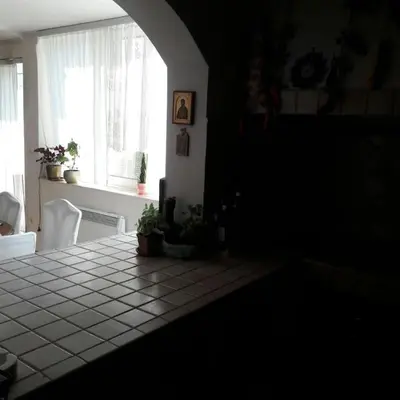 a dark room with a table and a window at Luxury place with a magnificent view in Budva
