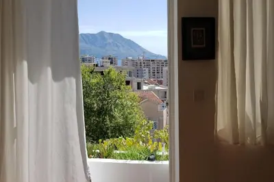 an open window with a view of a city at Luxury place with a magnificent view in Budva