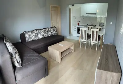 a living room with a couch and a table at Old Town Bar Apartments in Stari Bar