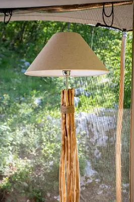 a lamp with a beige shade on top at Ashuma Retreat in Cetinje