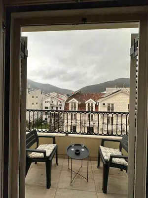 a view from a balcony with two chairs and a table at Saly Apart in Budva
