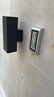 a pay phone is attached to a wall at Saly Apart in Budva