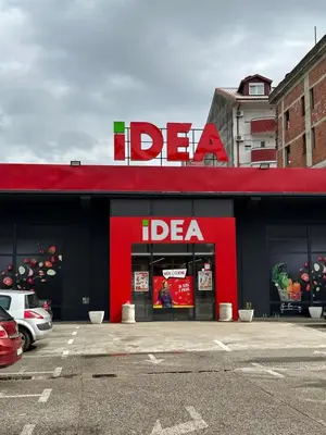 a red store front with a del taco sign on it at Selena apartment in Podgorica