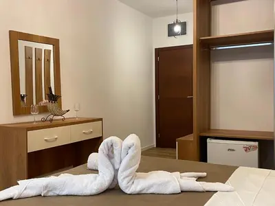 a room with two towels laying on a bed at Apartments Miri in Ulcinj