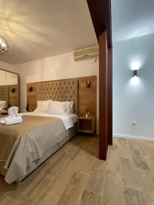 a bedroom with a large bed in a room at Apartments Miri in Ulcinj