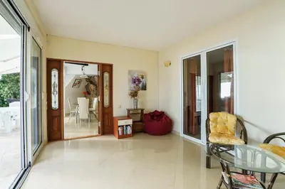 a living room with a glass table and a chair at Golden bay in Bar