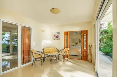 a living room with a table and chairs and a bedroom at Golden bay in Bar
