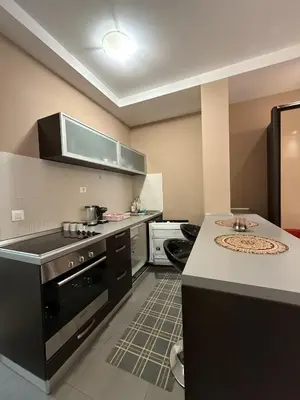 a kitchen with a stove and a counter top at Splendid Luxury Apartments in Budva
