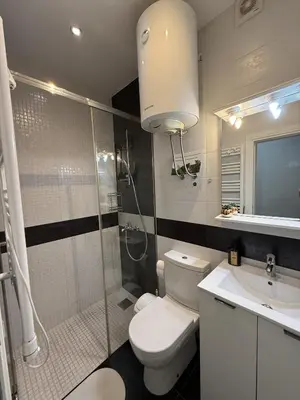 a bathroom with a toilet and a shower and a sink at Splendid Luxury Apartments in Budva