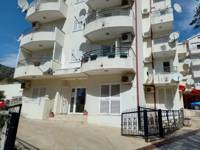 a building with balconies on the side of it at Splendid studio apartment in Becici