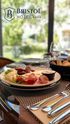 a plate of food on top of a table at Bristol Hotel Podgorica in Podgorica