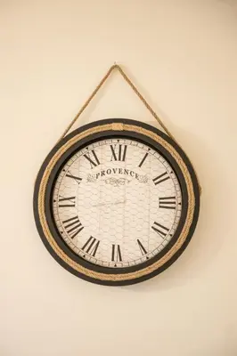 a clock hanging on a wall at Luxury AMAAA Apartment in Bar