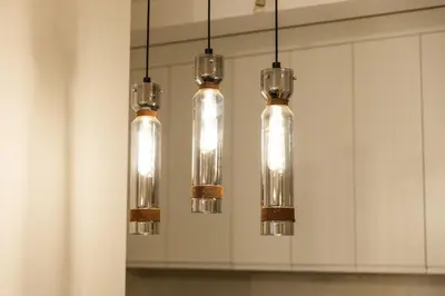 a group of glass lights hanging in a kitchen at Luxury AMAAA Apartment in Bar