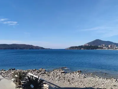 a view of the ocean with mountains in the background at Luxury Apartment Astelmn in Budva