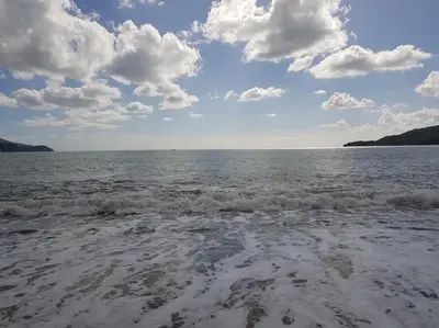 a view of the ocean from the beach at Стильная квартира с видом на море и библиотекой in Becici