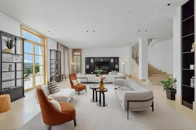 a living room with a couch and chairs and a table at Eterno Villas in Budva