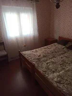 a bedroom with a bed and a window at Apartment Dubrava 112 in Dobra Voda