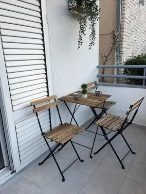 a table and two chairs sitting on a patio at Apartman Budva 07 in Budva