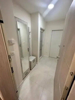 a bathroom with two mirrors and a walk in shower at Apartman VT 2 Central point in Podgorica