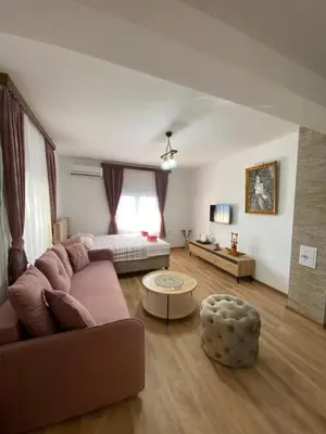 a living room with a couch and a table at Skadar Lake Apartment -Anja in Vranjina