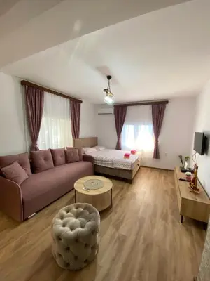 a living room with a couch and a table at Skadar Lake Apartment -Anja in Vranjina