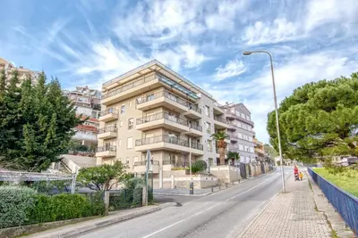 an empty street in front of a building at Apt 