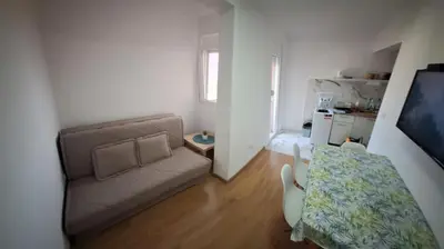 a small living room with a couch and a table at Apartmani Seaview in Sutomore