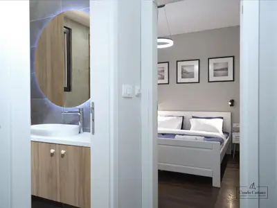 a bedroom with a bed and a sink and a mirror at Condo Cattaro in Kotor
